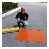 A person wearing a red hard hat and protective gear kneels on a paved surface beside an orange mat, preparing the UltraTech Drain Seal 213, part of UltraTech International's emergency response plan. A yellow emergency spill response container is nearby, indicating that stormwater management is underway outdoors on a clear day.