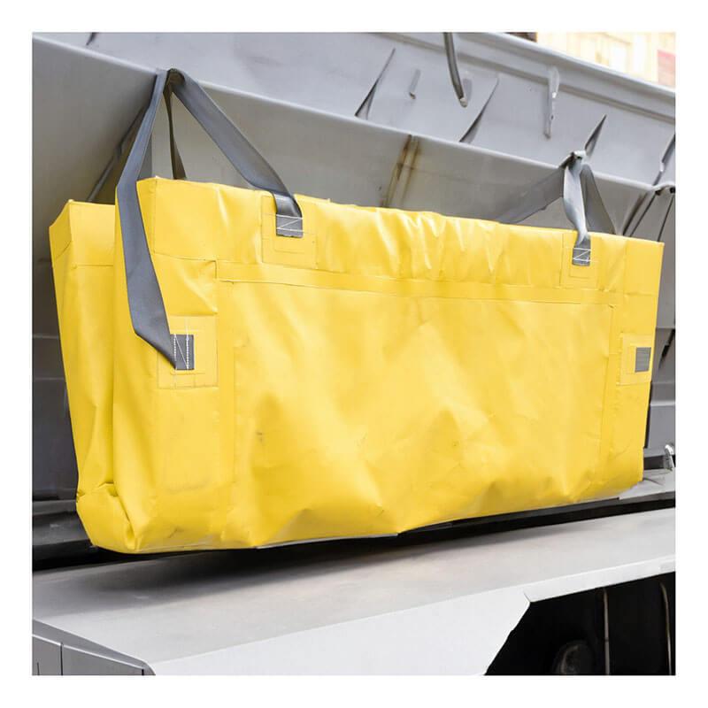 An UltraTech Containment Berm - Foam Wall XC Model 898, produced by UltraTech International, hangs in front of a metallic structure. It features a large, yellow, rectangular design with gray handles and is constructed from EVA material, giving it a sturdy and durable appearance ideal for industrial purposes such as spill containment.