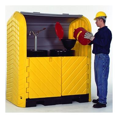 A person in safety gear pours liquid into a funnel on top of a large, yellow UltraTech Hard Top P2 Plus Spill Pallet 961_ from UltraTech International, which includes open doors for easy access. This spill containment system is equipped with a gray sliding cover to ensure the safe handling of hazardous drums.