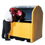 A person wearing a red hard hat and safety gear is handling a red container inside an UltraTech Hard Top P4 Plus Spill Pallet 963_, manufactured by UltraTech International. The spill pallet, ideal for outdoor storage, has a partially open lid that reveals its black interior.