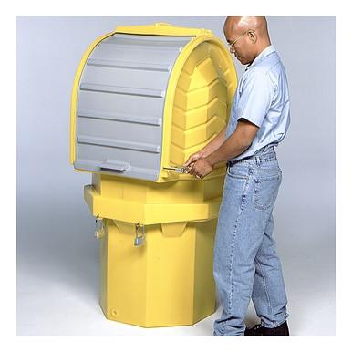 A person opens the UltraTech Hard Top P1 Plus Spill Pallet by UltraTech International. The large yellow plastic container with a gray lid resembles an outdoor containment unit and features a rounded top and square base. The person, dressed in a light blue shirt and jeans, appears prepared to efficiently tackle the task at hand.