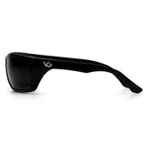A pair of Pyramex Venture Gear Vallejo black wraparound polarized sunglasses with dark lenses and a small silver logo on the arm is shown from the side on a plain white background.