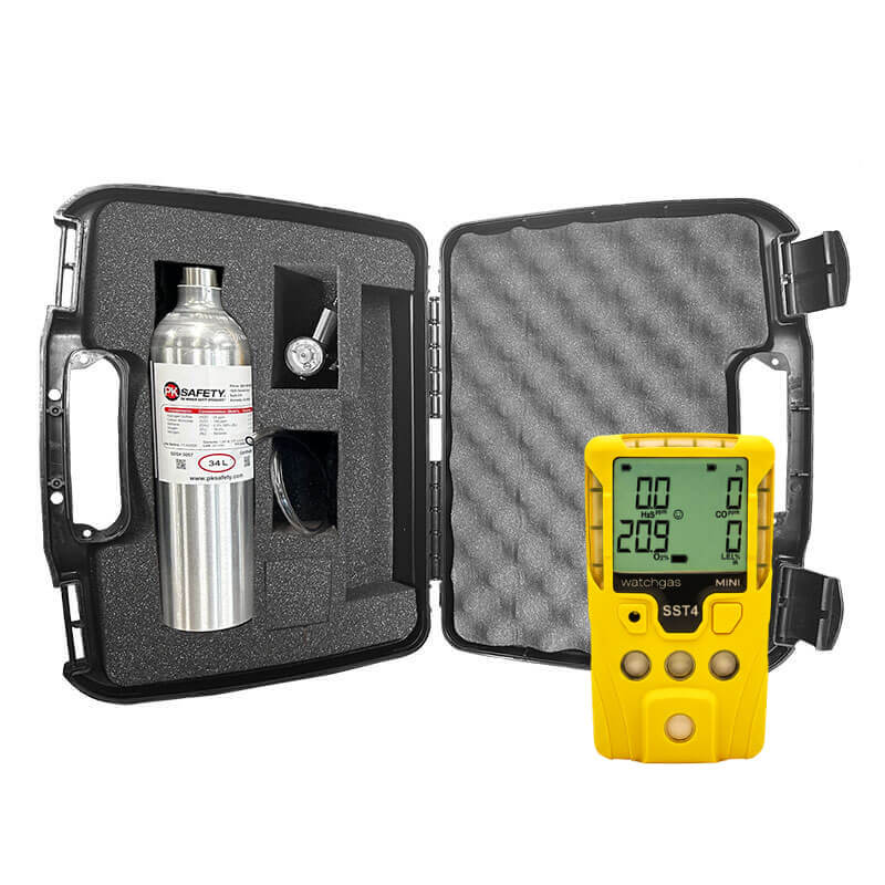 A black carrying case with foam inserts holds a silver gas cylinder and accessories from the WatchGas SST4 MINI Diffusion Bundle. Next to it is a yellow WatchGas confined space gas detector displaying readings on its digital screen.