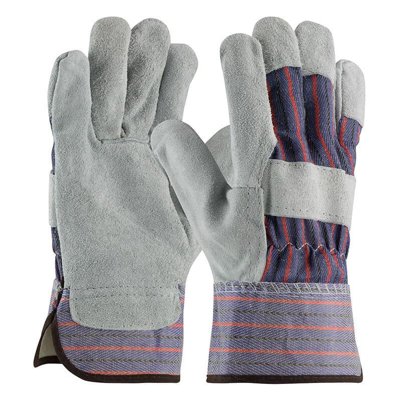 Introducing the PIP Split Cowhide Leather Palm Gloves with Fabric Back, perfect for winter work. These gloves feature durable gray leather on the palms and fingers, complemented by a blue and red striped fabric on the back. Designed specifically for cold weather tasks, they include reinforced cuffs to provide additional protection.