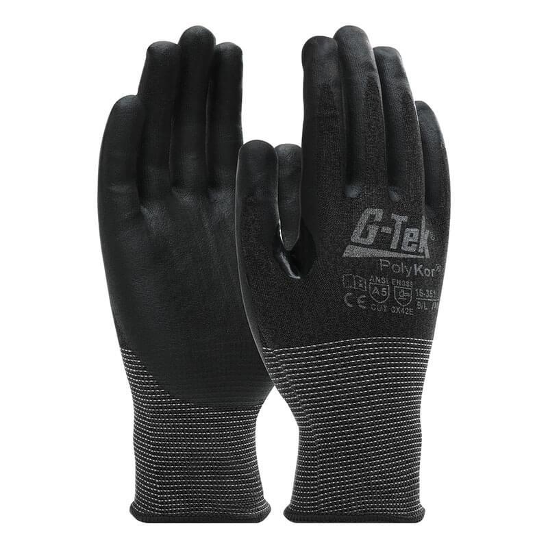 PIP - Protective Industrial Products presents the PIP G-Tek PolyKor Glove with Nitrile Coated Foam Grip 16-351, featuring a black color with a reinforced wrist area and touchscreen compatibility. The gloves also have lettering and safety standards displayed on the back.