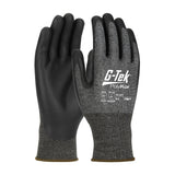 The PIP G-Tek PolyKor X7 16-377 gloves from Protective Industrial Products are cut-resistant with black palms and dark gray fabric on the back. They have white text and logos indicating the model and high cut resistance, plus they offer touchscreen compatibility for added convenience.