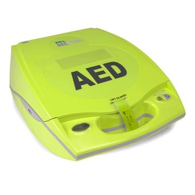 The ZOLL AED Plus Defibrillator Package 8000-0040_ _-01 by ZOLL is a bright yellow AED with a handle and "AED" on the lid, designed for cardiac emergencies and featuring Real CPR Help for effective response.