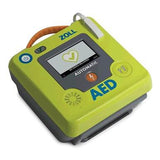 The ZOLL AED 3 Defibrillator Package 8511-00110_-01 is a green device with screen, yellow and power buttons, attached orange cable, and Real CPR Help, designed by ZOLL for swift and effective emergency cardiac response.