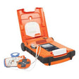A ZOLL Powerheart G5 AED Defibrillator Package (G5_-80C-S) with its orange lid open, connected by wires to electrode pads that feature illustrated instructions for proper chest placement.