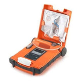 An orange ZOLL Powerheart G5 AED Defibrillator Package G5_-80C-S with its lid open displays electrode pads, a screen, buttons, and cables inside, all designed for fast emergency response and Intellisense CPR support.