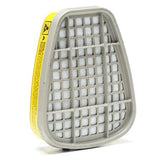 A 3M 6003 Organic Vapor / Acid Gas Cartridge in gray with a grid pattern and yellow label is positioned upright against a white background, designed to offer acid gas protection for respirators.