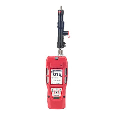 The red GX-6000 device, known as the RKI GX-6000 for Benzene Multi-Gas 72-6AZX-C from RKI Instruments, is equipped with a digital display showing "015." It includes multiple buttons and a PID sensor probe extending from the top to detect benzene, measure gas levels, and ensure safety.