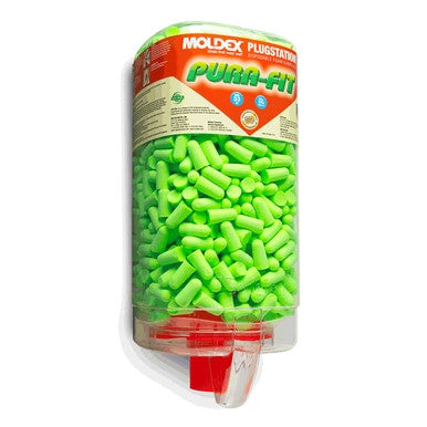 The Moldex Pura-Fit Ear PlugStation Dispenser 6845, which is wall-mounted and filled with vibrant green earplugs, offers excellent hearing protection. Its transparent container displays numerous foam earplugs, while the red dispensing area below allows for easy access.