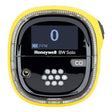 The Honeywell BW Solo Wireless Gas Detector CO BWS1-ML-Y, by BW Technologies, features a bright yellow casing. Part of the Safety Suite, its display reads "0 PPM," indicating no CO detected. The front shows a grid of white dots and a small sensor for efficient detection.