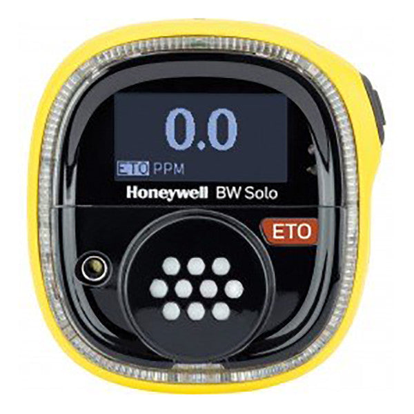 A Honeywell BW Solo Wireless Gas Detector ETO BWS1-E-Y from BW Honeywell in yellow shows "0.0" on its screen, alongside indicators for "ETO" and "PPM." This wireless device includes a black front panel with a button and sensor grid.