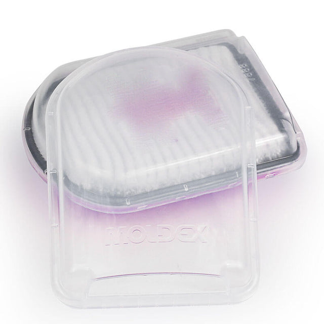 The Moldex Filter Disk Cover 7888, available in cases of 30 pairs, features transparent plastic casings with inner white filters that stack neatly. The filters have a slight purple tint to enhance their protective clarity and efficiency, and the name "Moldex" is embossed on each case.