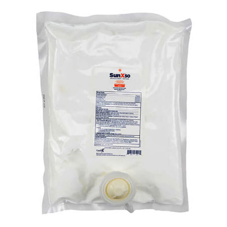 A sealed, transparent, rectangular plastic bag filled with liquid for comprehensive skin protection, featuring a front label and a bottom spout. The label showcases the text and logo "Coretex Sun X 50," ideal for individuals looking for premium sunscreen.