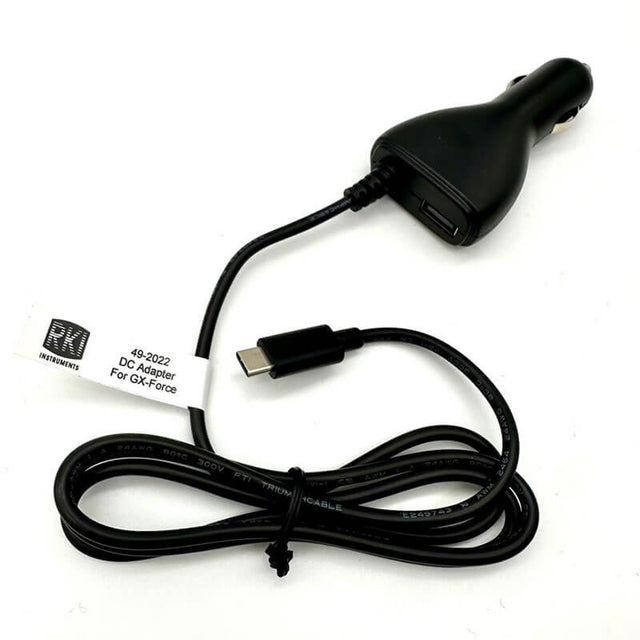 Introducing the RKI GX-Force 12-24 VDC DC Adapter with Vehicle Plug from RKI Instruments—a black car charger featuring a USB-C connector and coiled cable, complete with a label that reads "DC Adapter For GX-Force" along with detailed specifications. Its Vehicle Plug design ensures it integrates effortlessly into any car power outlet, providing convenient charging for your gas monitor while on the move.