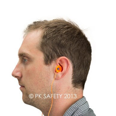 A man with short hair is wearing Howard Leight Quiet Reusable QD30 Corded Earplugs, shown in orange, viewed from the side against a plain white background, guaranteeing optimal noise reduction and hearing protection.