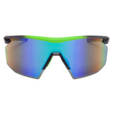 The Pyramex PMXSPEC Green Mirror Safety Glasses SBL11257ST offer sporty style with their colorful reflective lenses and a distinctive green top frame complemented by black accents. Designed for athletic activities, these sleek glasses come equipped with anti-fog lenses.