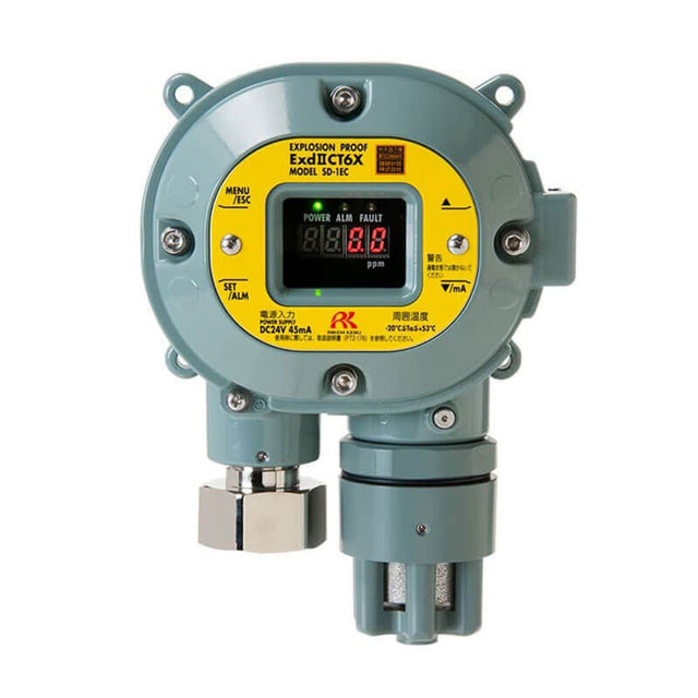 The RKISD-1EC H2S Detector by RKI Instruments is a round, industrial gas detector featuring a digital display that reads "0.0 ppm," specifically designed for detecting hydrogen sulfide. It has an explosion-proof design and includes menu and settings buttons. The gray device with a yellow label also comes equipped with HART Communication connectors for wiring at the bottom, providing added functionality without relays.