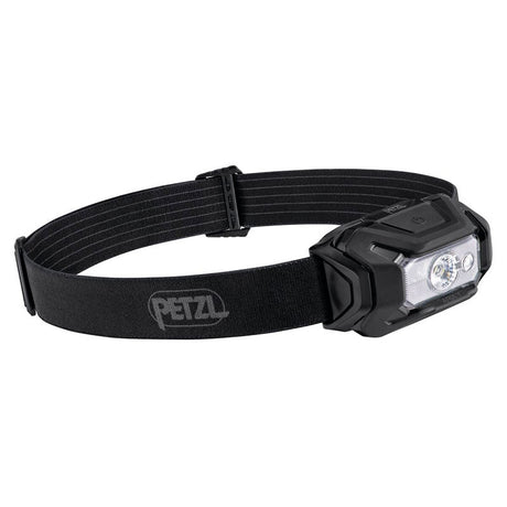 Introducing the Petzl ARIA 1 RGB Headlamp E069BA00, featuring a sleek black design with an adjustable elastic strap. Equipped with two LED lights on the front, this waterproof headlamp ensures hands-free illumination for outdoor activities. The durable construction is complemented by the "Petzl" logo prominently displayed on the strap.