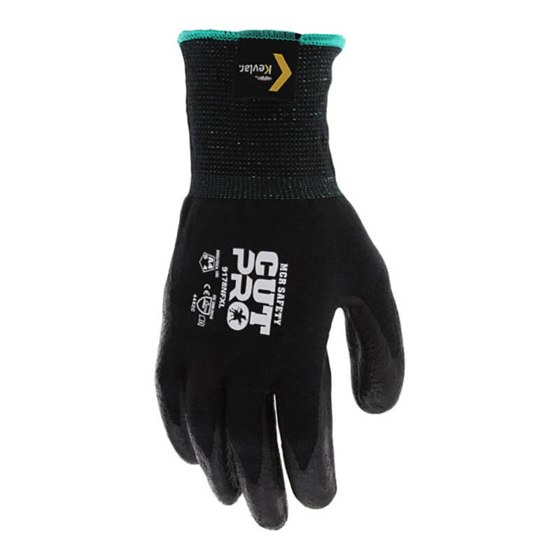 The MCR Safety Memphis Black Kevlar Cut Protection Gloves 9178NF feature "CUT PRO" and safety symbols on the back, a textured grip, green cuff trim, cut-resistant Kevlar technology, and are shown with the palm facing the viewer. Sold as 12 pairs.