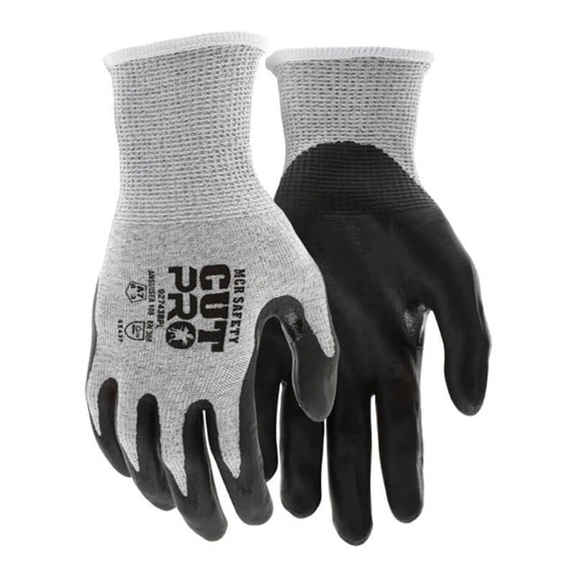 A dozen MCR Safety Cut Pro 13G HyperMax Bi-polymer Gloves (92743BP) in gray/black, featuring "CUT PRO" and safety icons on the back, offer certified cut protection for industrial and construction work.