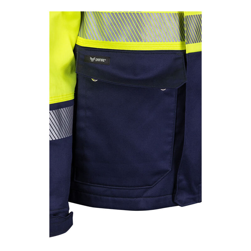 Close-up of the NSA DRIFIRE FR Hi-Vis Insulated Jacket JKT-01C3-HV, showcasing its bright yellow upper section, dark blue lower pocket with reflective stripes, and a flame resistant design that meets ANSI/ISEA 107 compliance. A small ONFIRE label is visible above the pocket.