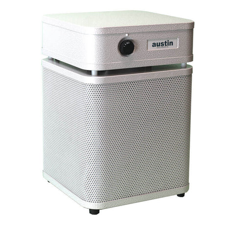 The Austin Air Systems HealthMate Junior Machine A200 is a white, box-shaped HEPA air purifier with a perforated exterior, front control knob, "austin" label, and four small feet—perfect for reducing allergies.