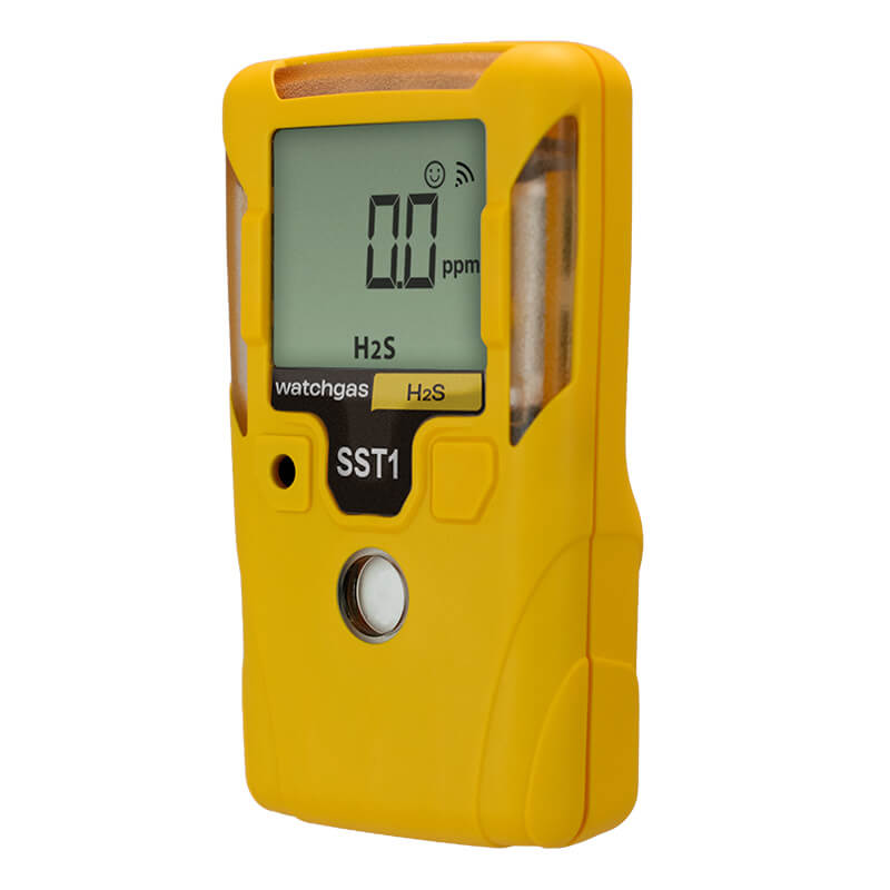 A yellow handheld WatchGas SST1 Serviceable H2S Gas Detector (model SST1-H) displays “0.0 ppm” for hydrogen sulfide (H₂S) on its screen, with the brand name “WatchGas” visible.